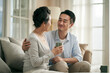 © imtmphoto - asian adult son chatting with senior mother at home