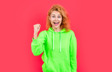 Wall Mural - photo of successful stylish girl in hoodie. redhead stylish girl on color background. stylish girl