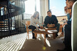 © Flamingo Images - Diverse group of businesspeople reading through paperwork in an office
