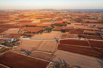 Sticker - Drone view of fields with red soil around Avgorou village in Famagusta District in Cyprus island country