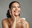© K.A./peopleimages.com - Black woman, smile and face beauty cream for skincare wellness shine, cosmetics dermatology and salon spa product in studio. African girl, spf lotion and self care happiness for luxury facial glow
