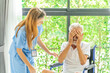© SKW - Man being cared for by a private Asian nurse at home suffering from Alzheimer's disease to closely care for elderly patients with copy space on left