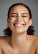 © K.A./peopleimages.com - Face, beauty and funny with a model black woman in studio on a gray background laughing for skincare. Facial, wellness and makeup with an attractive young female happy with her skin product