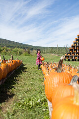 Girl at pumpkin patch