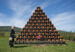 © Mel Karlberg/Stocksy - Girl and grandma looking at pumpkin tower at a patch
