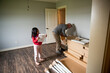 © Mel Karlberg/Stocksy - Father and daughter organizing building project