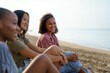 © Jovo Jovanovic/Stocksy - Cheerful diverse women having leisure time at beach