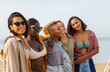 © Jovo Jovanovic/Stocksy - Stylish women enjoying during summer holiday at beach