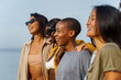 © Jovo Jovanovic/Stocksy - Cheerful diverse friends having fun at beach
