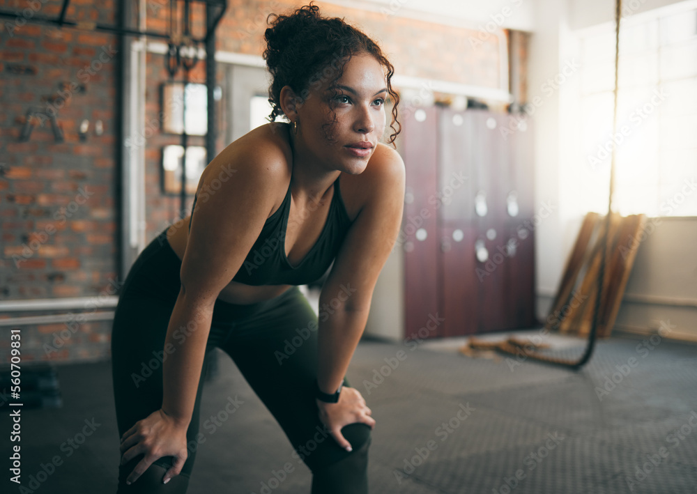 Tired, exercise and woman at gym after fitness workout or training for ...