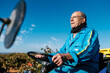 © Ezequiel Giménez/Stocksy - Senior farmer driving truck in field