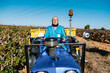 © Ezequiel Giménez/Stocksy - Senior man driving farm truck in field