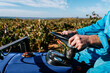 © Ezequiel Giménez/Stocksy - Crop farmer driving truck in countryside field