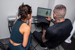 © Bisual Studio/Stocksy - Sportspeople analyzing full body scan on laptop
