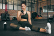 © K.A./peopleimages.com - Fitness, phone and woman at gym for a workout, training and body wellness with a mobile app. Young sports female with smartphone for progress, performance and communication for a healthy lifestyle