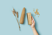 Golden Wheat, Corn And Ingot In Female Hand.