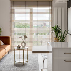 Big window with wooden blinds in elegant studio apartment