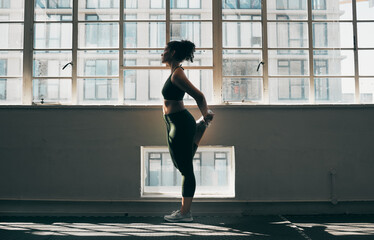 Poster - Exercise, stretching and a woman at gym for fitness workout for health and body wellness with muscle warm up. Sports female or athlete stretch legs at window for balance, energy and healthy lifestyle