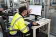 © Tongpool - Engineer sitting in robot electronic room use computer create process analogue and logic diagram