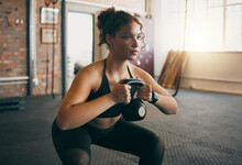 Fitness, Kettlebell And A Woman At Gym Doing Workout, Exercise And Weight Training For Body Wellness And Muscle. Strong Sports Female Or Athlete With Weights For Power, Energy And A Healthy Lifestyle