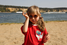 Stylish Girl In Sunglasses On Beach