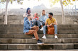 © K.A./peopleimages.com - Relax, friends or students on stairs at break talking or speaking of future goals or education on campus. Diversity, school or happy young people in university or college bonding in fun conversation