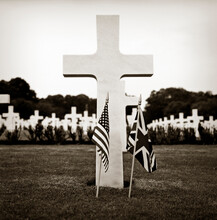 WWII Grave Marker With American And United Kingdom Flags.
