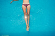 © Luis Herrera/Stocksy - woman body floating on a swimming pool