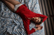 © Ivan Ozerov/Stocksy - Alluring young lady recreating on soft bed at home