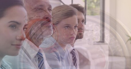 Canvas Print - Composite video of watch mechanism against diverse businesspeople having a meeting at office