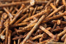 Background Pile Of Rusty Nails In A Warehouse