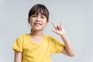 An adorable little asian girl show her hand, the sign hand language 