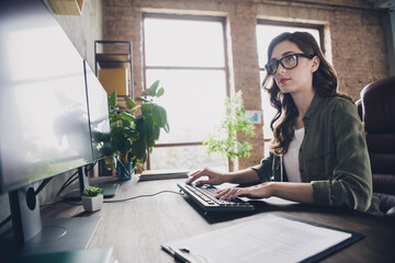Profile photo of talented clever web designer lady sitting chair keyboard write operating network open space indoors