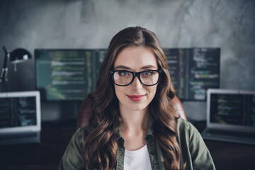 Photo of positive cheerful lady freelancer wear glasses typing code modern device indoors workstation workshop
