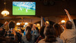 © Gorodenkoff - Soccer Club Members Cheering for Their Team, Playing in an International Cup Final. Supportive Fans Standing in a Bar, Cheering, Raising Hands and Shouting. Friends Celebrate Victory After the Goal.