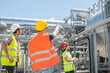 © Cavan Images - Engineer with his colleagues in meeting and showing something at geothermal power station, Bavaria, Germany