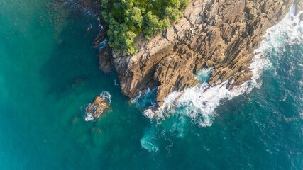 Wall Mural - Aerial view of cliff and waves at Sri Lankan Beach. 