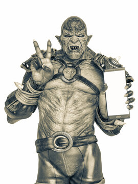 orc warrior holding a cellphone and doing a peace and love pose