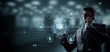 © natali_mis - Businessman working with risk management on virtual screen.