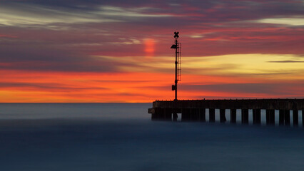 Wall Mural - sunset at the pier in long exposure