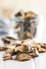 Sticker - Sliced dried mushrooms on white table.