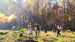 © ihorvsn - Ecological volunteers working on sunny fall day in forest and planting seedlings of trees. Outdoors. Caucasian males and females coworking together and aving our planet. Eco interaction.