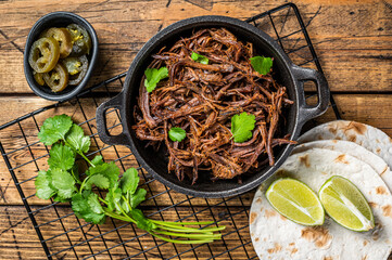 Poster - Cooking of mexican pork carnitas taco. Wooden background. Top view