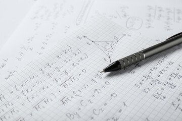Wall Mural - Sheets of paper with different mathematical formulas and pen, closeup