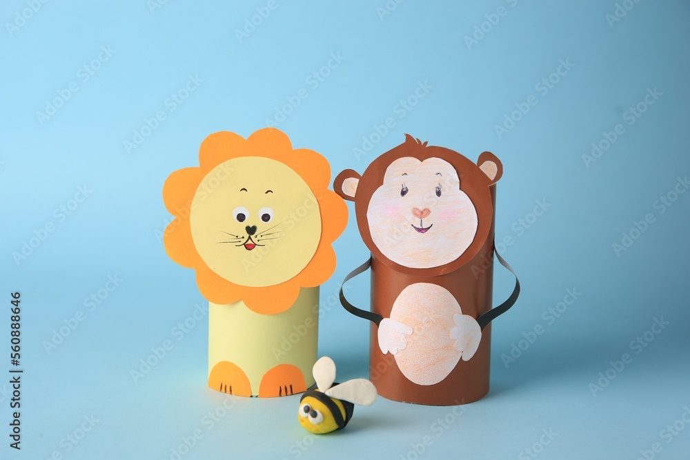 Toy monkey and lion made from toilet paper hubs with plasticine bee on ...