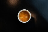 Fototapeta Mapy - black coffee on a paper cup served on white table at cafe​