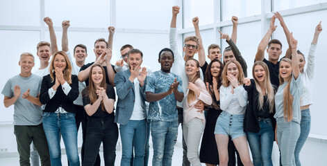 Wall Mural - team of happy young people showing their success