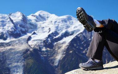 Wall Mural - Hiker resting in the Graian Alps. Mont Blanc mountain range, Nature Reserve Aiguilles Rouges, France.