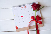 Red Rose And A Heart On Calendar Isolated On White Wooden Background With. Valentine's Day Concept. Planning Scheduling Agenda, Event, Organiser Valentines Day. Flat Lay, Top View.