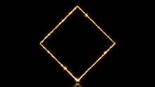 Gold Sparkler Firework Frame With Diamond Shape On Black. Holiday Background With Copy Space.